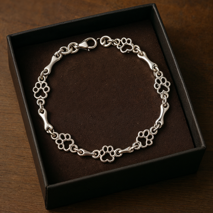 Silver bracelet with dog paw and bone charm