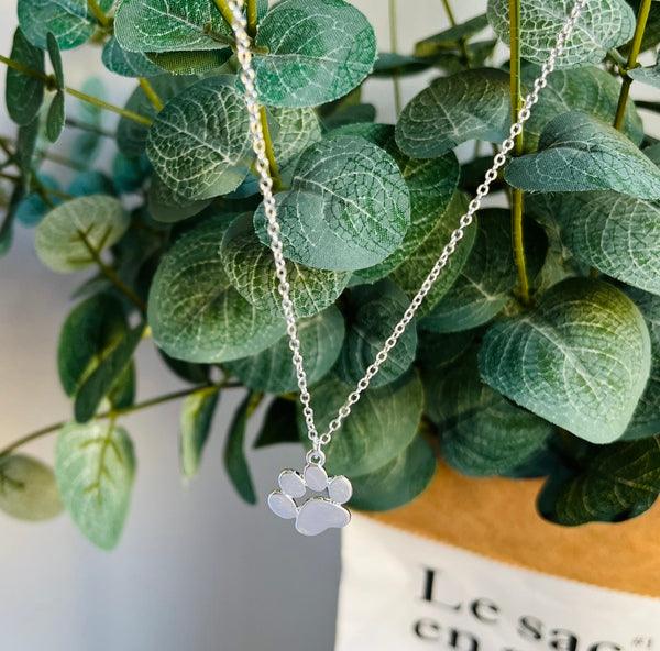 Elegant silver pendant with paw print on a chain