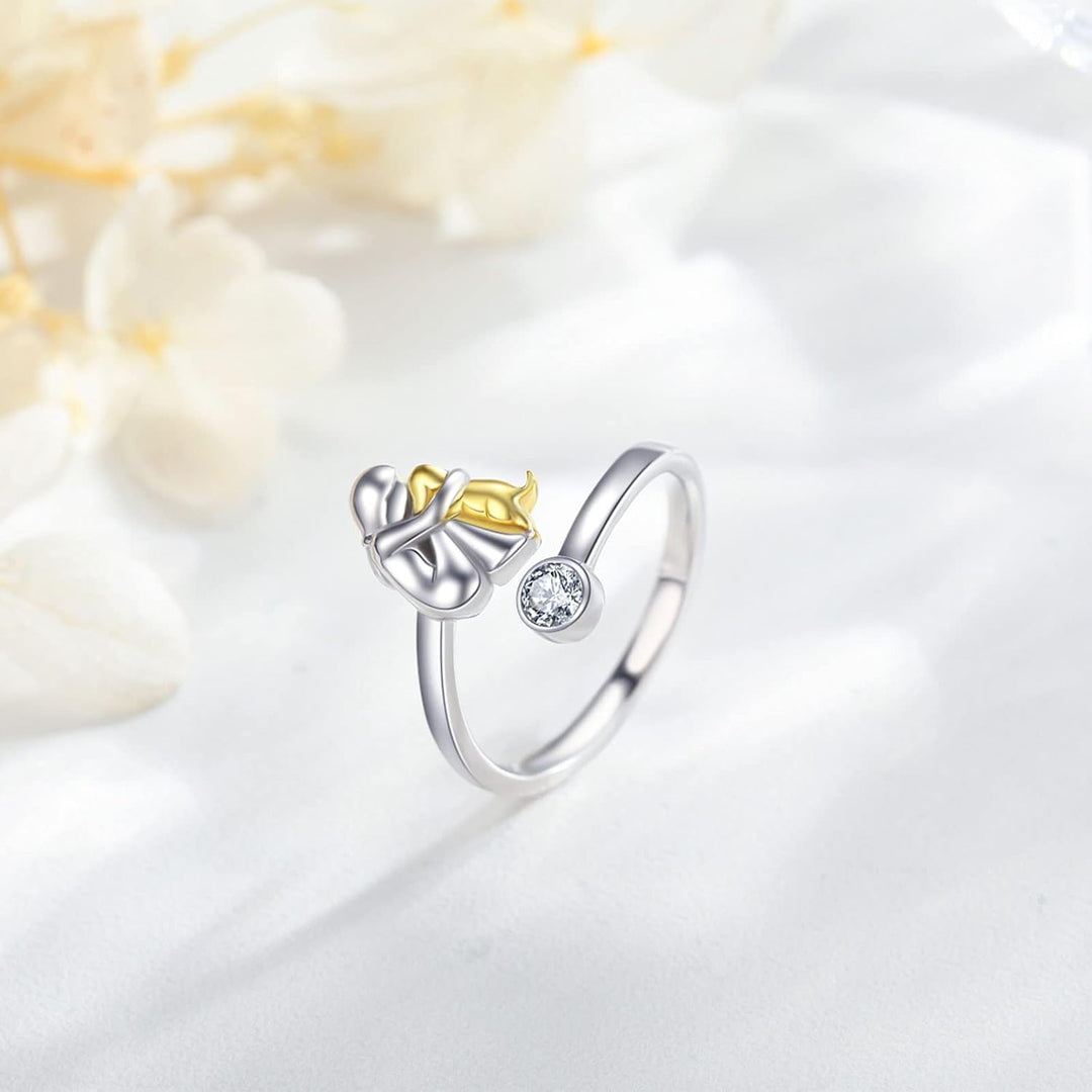 Silver ring with a dog and zirconia stones.