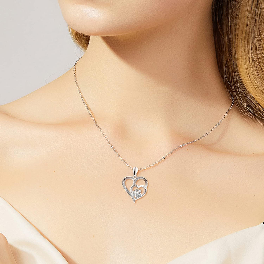 Sterling silver necklace with paw print and heart, set with zirconia.