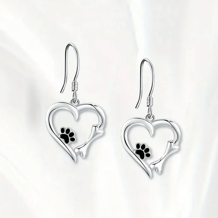 Silver dangling earrings with heart and paw print motif