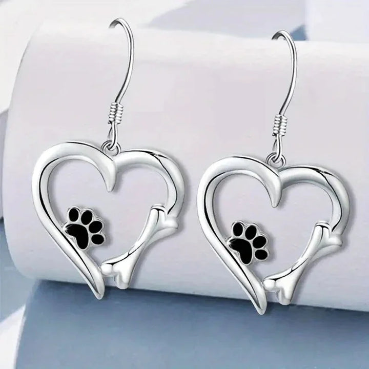 Silver dangling earrings with heart and paw print motif