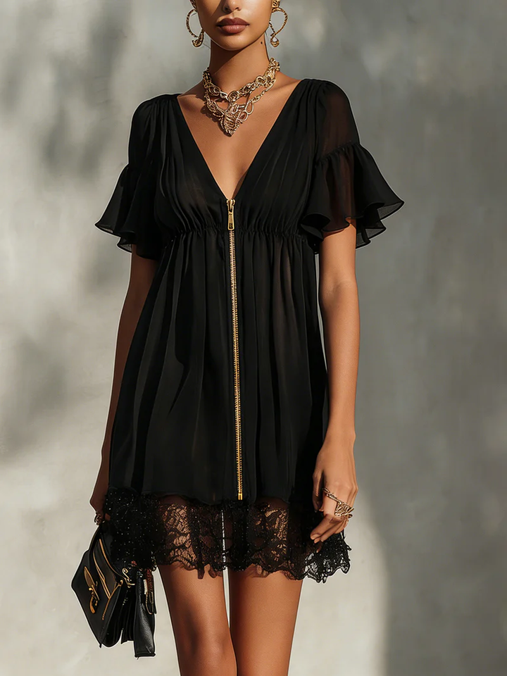 Robe mini noire avec finitions en dentelle, fermée par une fermeture éclair, décolleté en V
