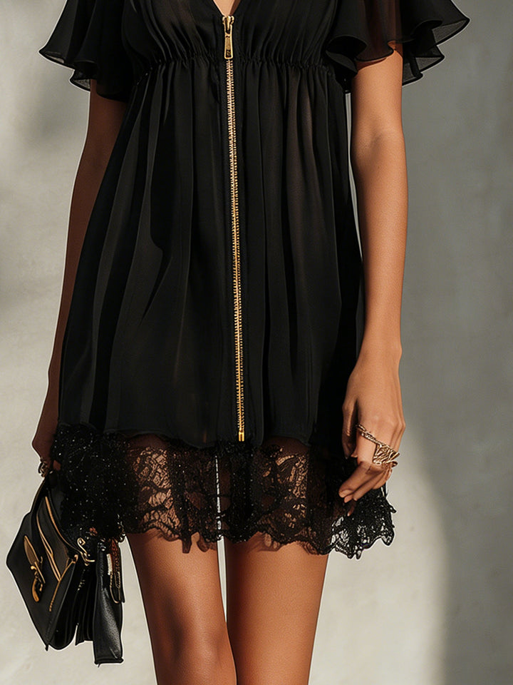 Robe mini noire avec finitions en dentelle, fermée par une fermeture éclair, décolleté en V