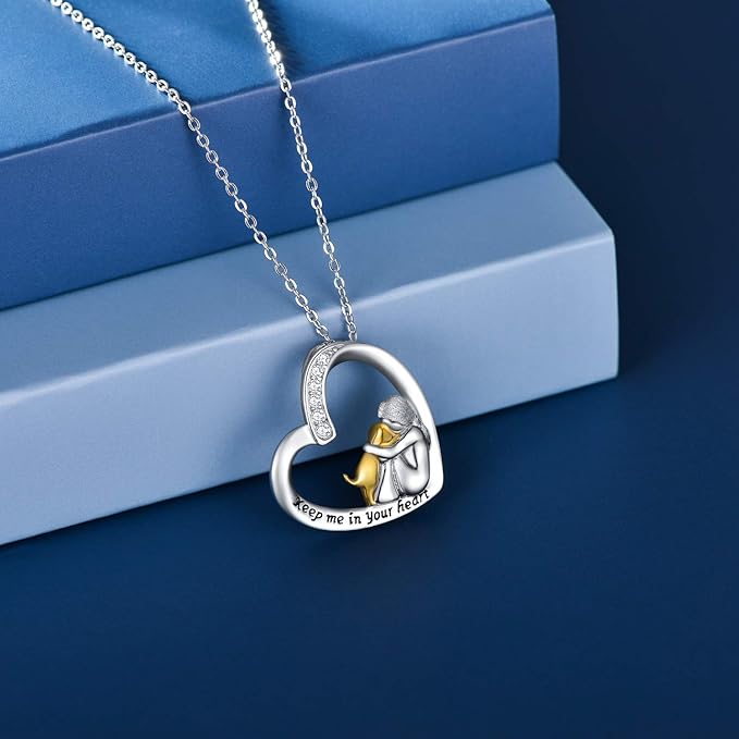 Silver necklace with heart, dog, and zirconia stones